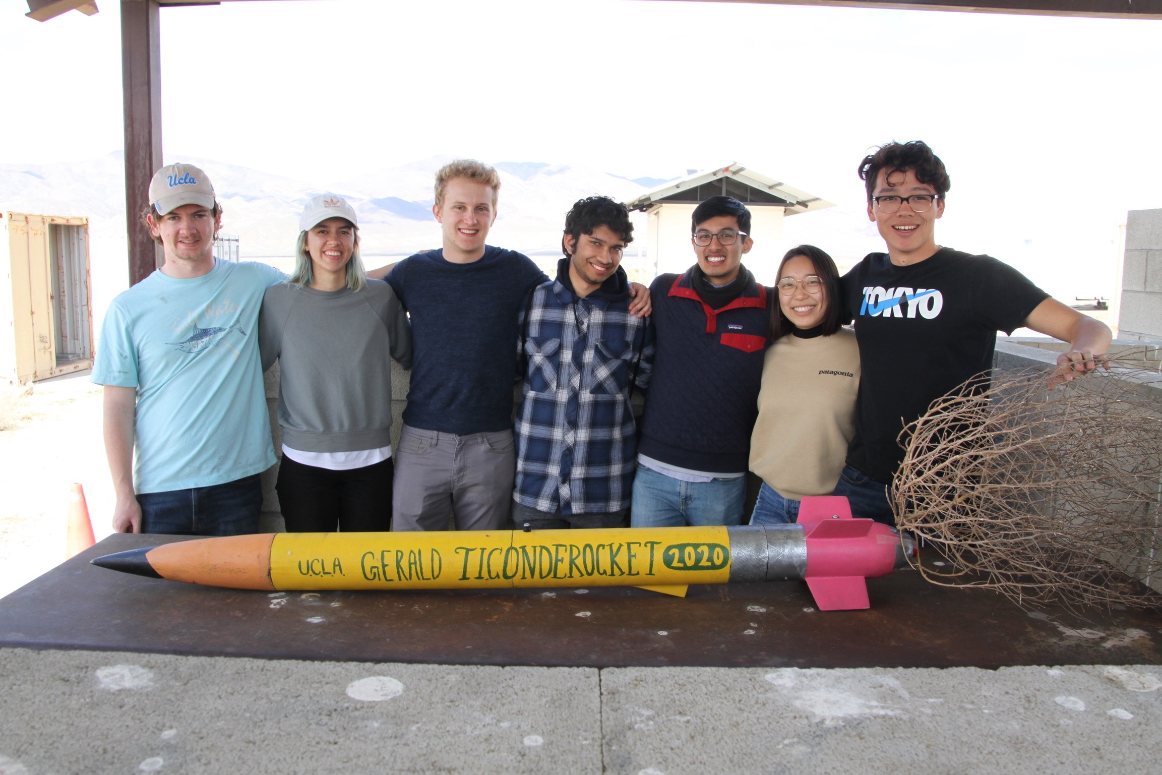 Rocket Project members in front of rocket