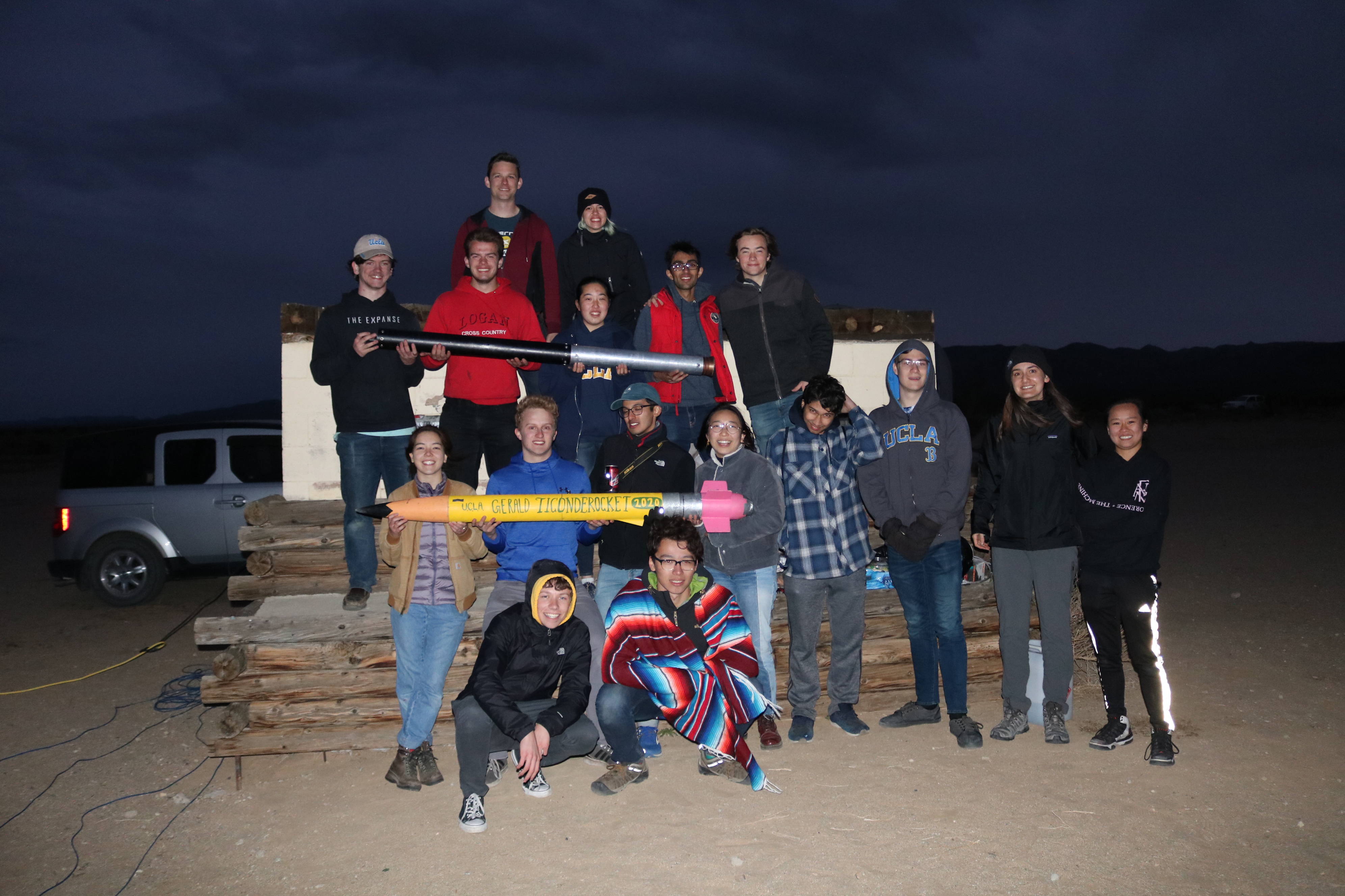 Rocket Project members holding rocket